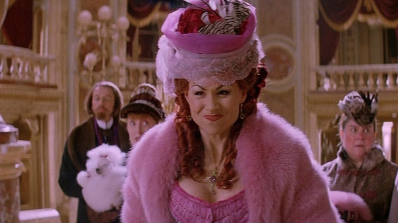 Carlotta wearing a pink hat and dress