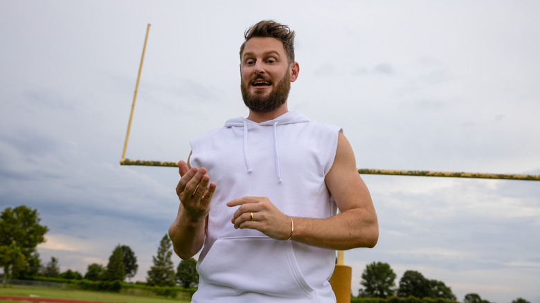 Bobby Berk talking on field