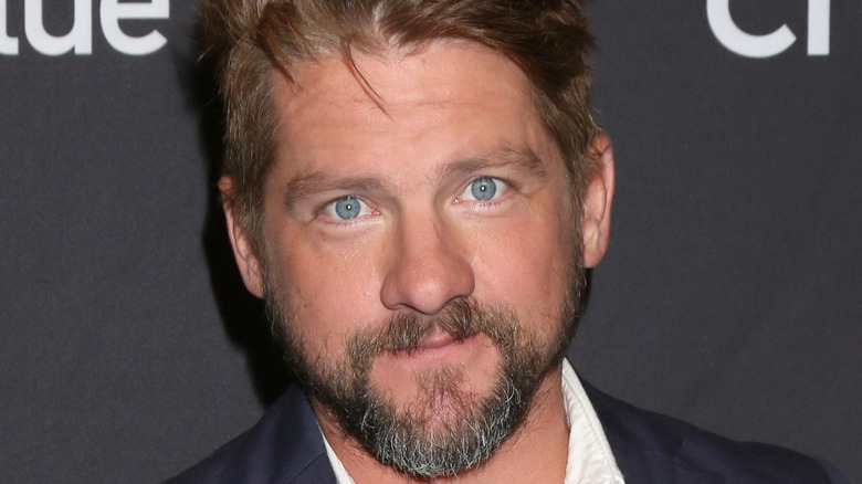 Actor Zachary Knighton smiles