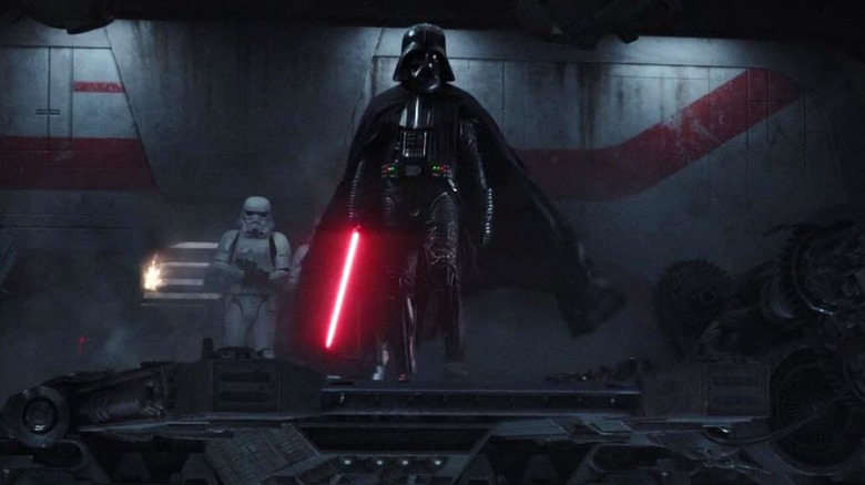 Darth Vader looks ahead while holding his lightsaber in Rogue One: A Star Wars Story (2016)