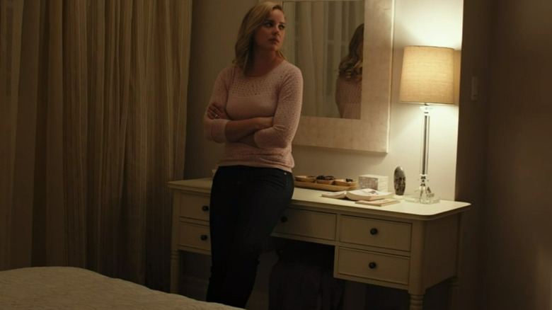 Clara Murphy leaning against desk