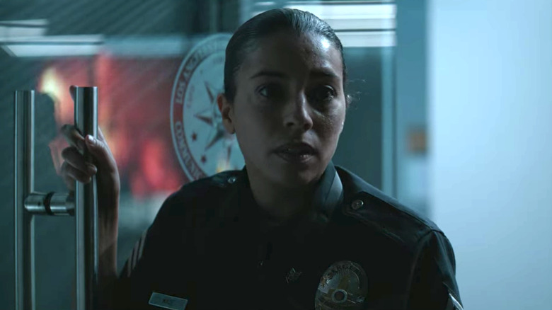 Christina Vidal holding door open