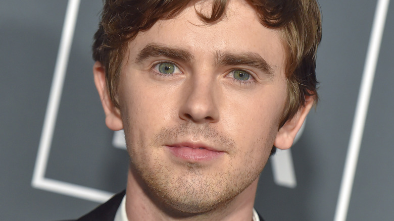 Actor Freddie Highmore  looking serious