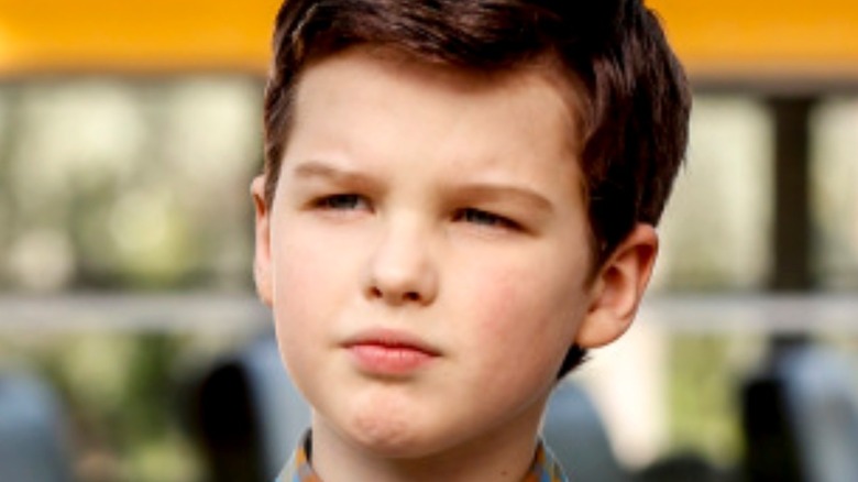 Young Sheldon looking smug