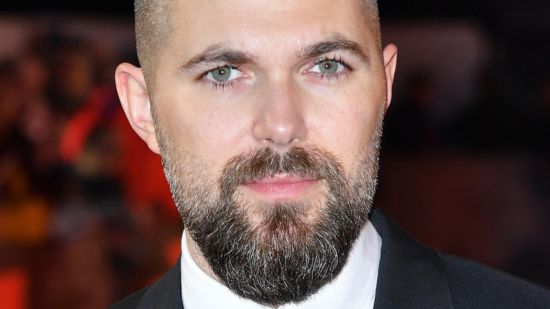 Robert Eggers wearing a neutral expression