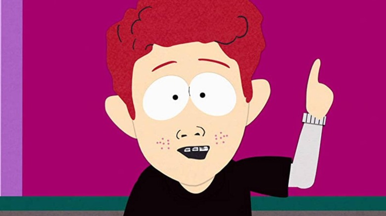 Scott Tenorman pointing his finger against a hot pink background