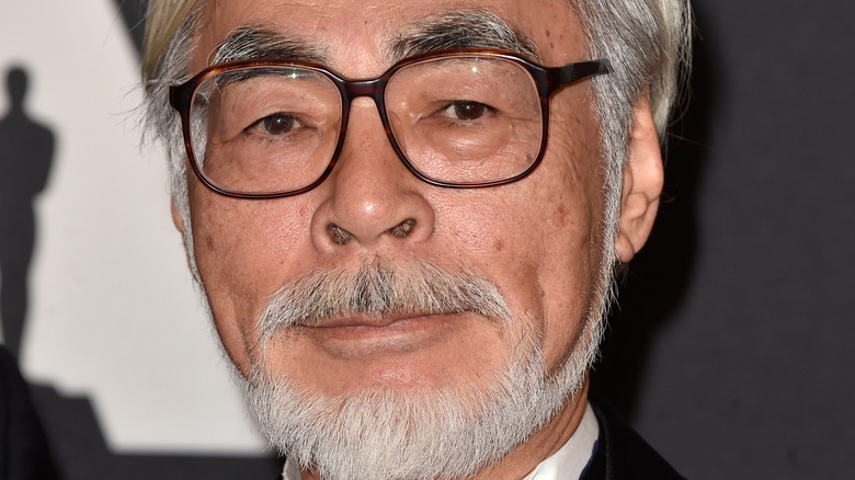 Hayao Miyazaki posing at an event