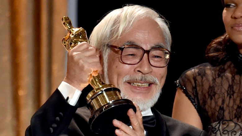 Hayao Miyzaki smiling with his Oscar award