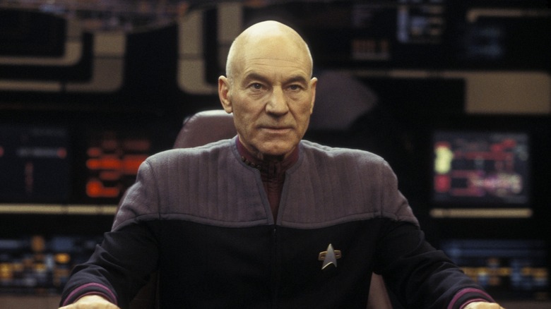 Picard intensely sitting in the captains chair in Star Trek: Nemesis
