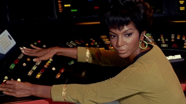 Nyota Uhura sitting at a control panel in Star Trek: The Original Series (1967)