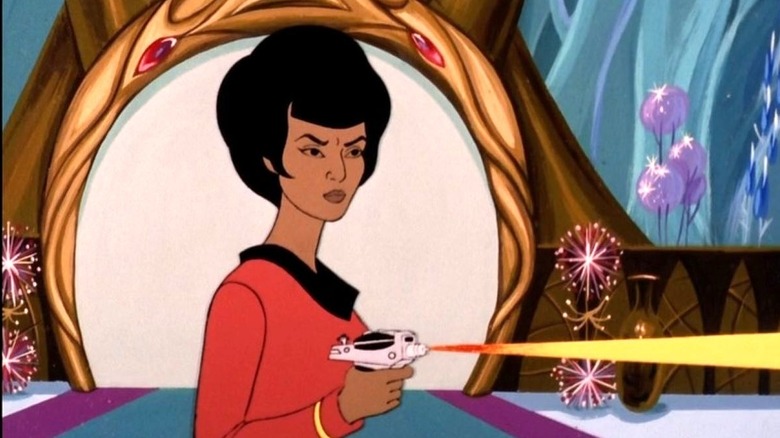 Nyota Uhura stands while firing her phaser in Star Trek: The Animated Series