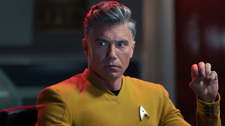 Captain Pike sits in the command chair in 