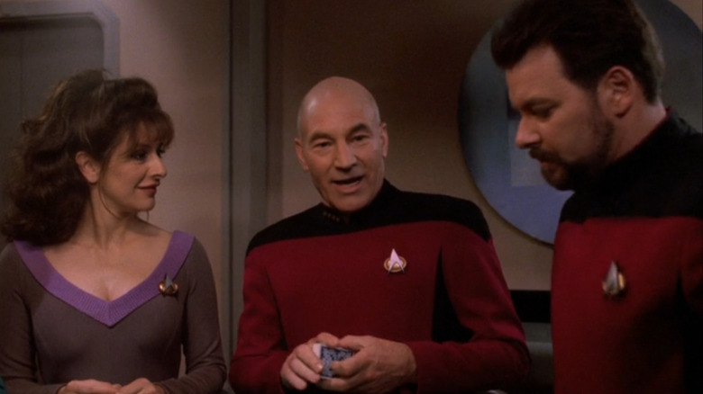 Deanna Troi, Jean-Luc Picard, and William Riker talking