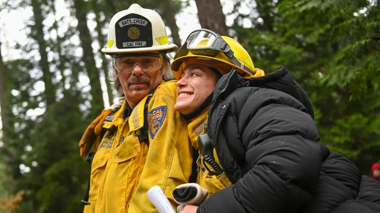 Gabi and Vince walk through the woods in Fire Country