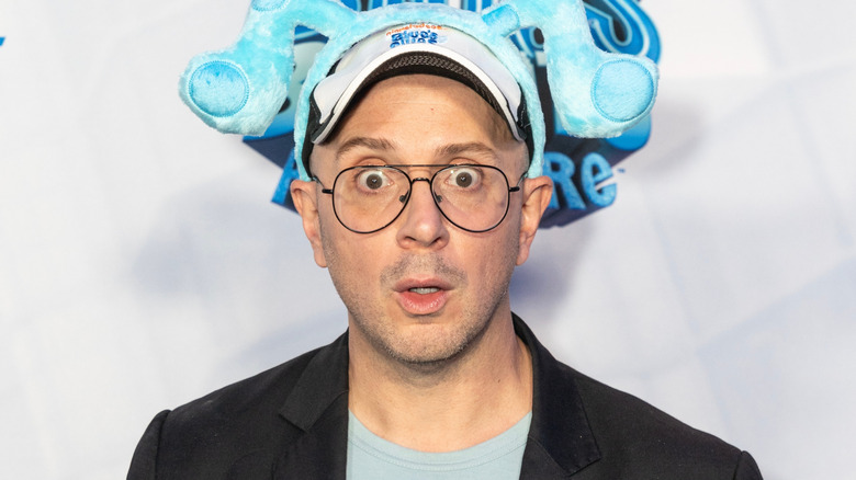Steve Burns wide-eyed in front of white background