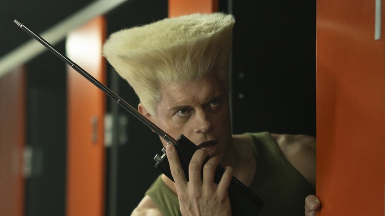 Guile using a massive walkie-talkie in the bathroom in Street Fighter (2026)