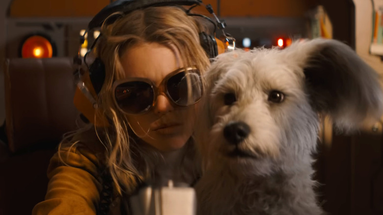 Kara Zor-El sitting with Krypto in Supergirl
