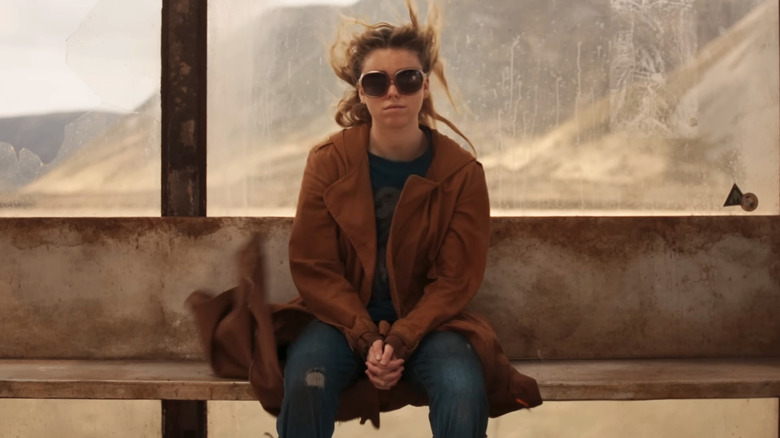 Kara Zor-El sitting on a bench in Supergirl
