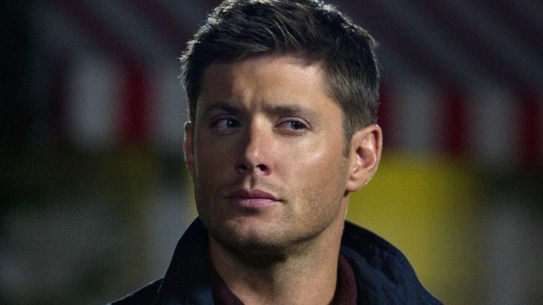 Dean stares at someone in suspicion