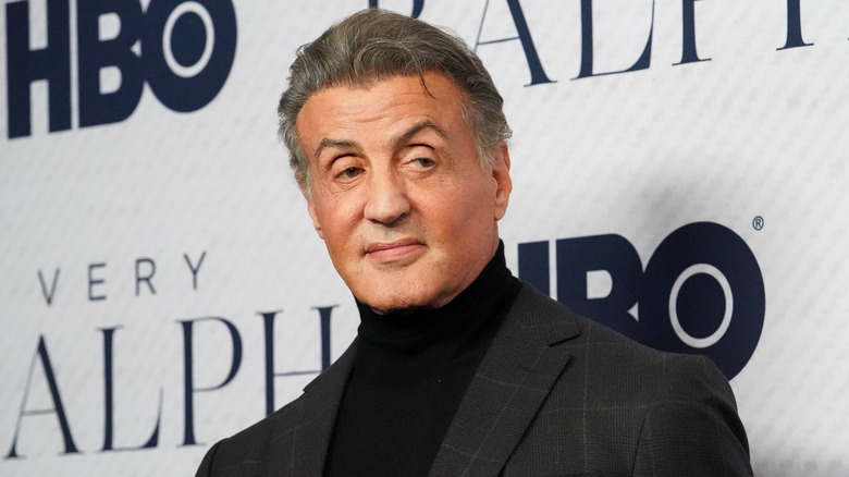Sylvester Stallone looking to the side