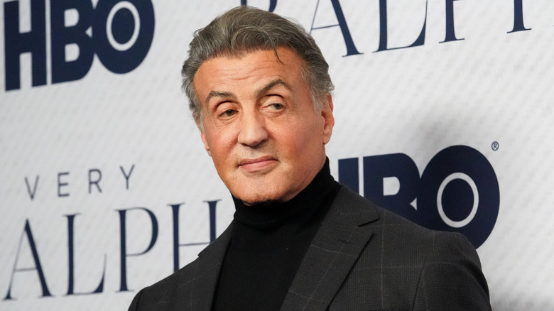 Sylvester Stallone looking to the side