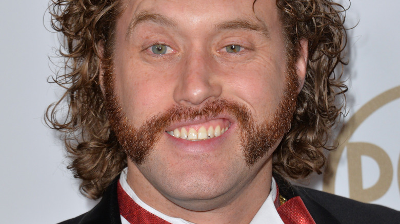 T. J. Miller smiling, we think