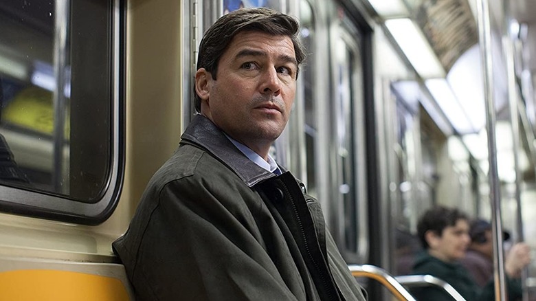 Patrick sitting on subway