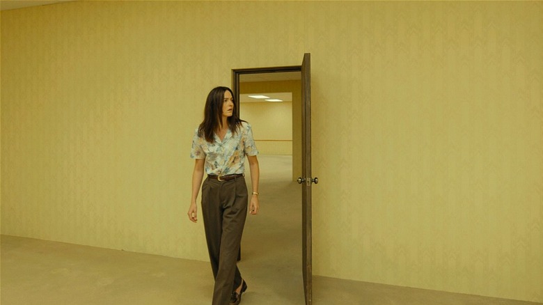 Mary walking through a door in 