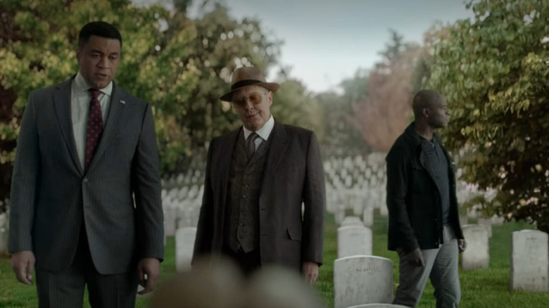 Red and Harold stand in cemetery