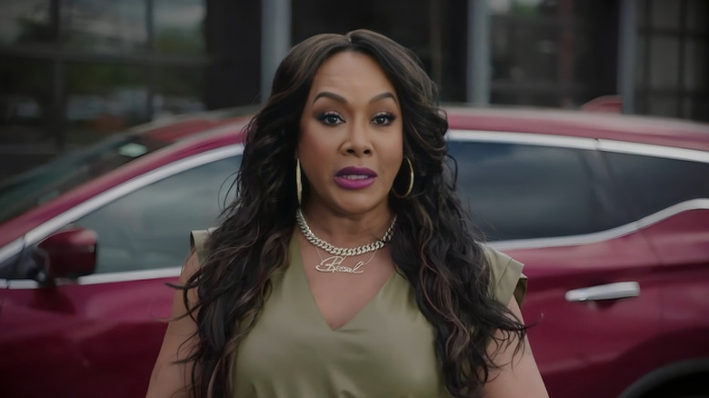 Vivica A. Fox in front of car