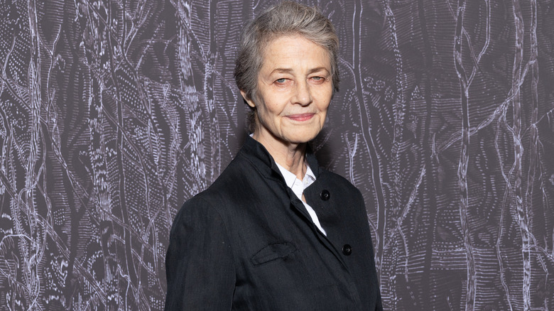 Charlotte Rampling in overcoat