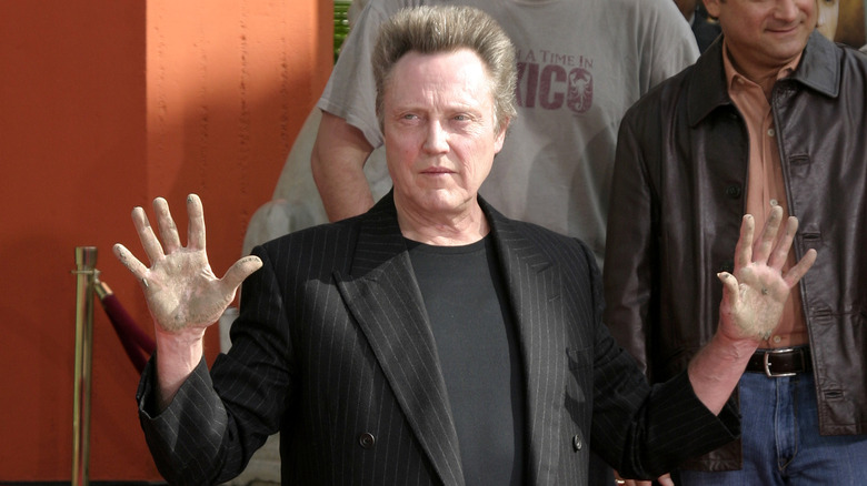 Christopher Walken holding hands up