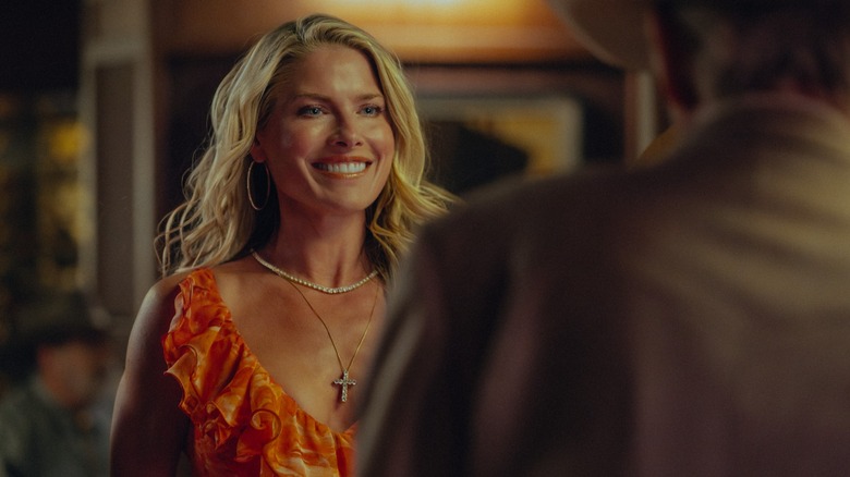 Ali Larter as Angela Norris in Landman, smiling widely