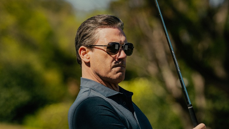 Jon Hamm as Monty playing golf in Landman