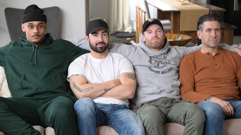Dolo, Andrew, Shoresy, and Hitch sitting side by side on a couch in "Shoresy."