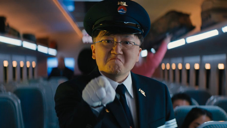 The conductor points angrily