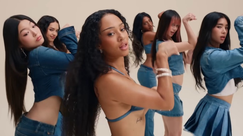 Yoonchae, Daniela, Manon, Lara, Megan and Sophia from Katseye dancing in front of a white background