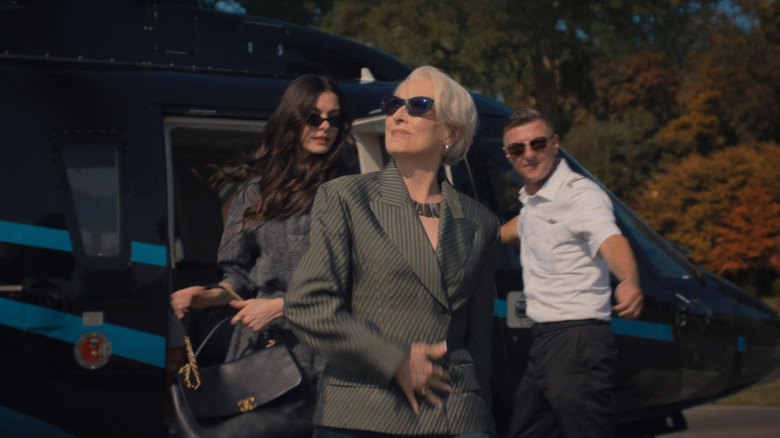 Andy Sachs and Miranda Priestly exiting a helicopter in "The Devil Wears Prada 2" (2026)