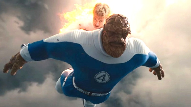 The Human Torch carrying The Thing into battle in The Fantastic Four: First Steps (2025)