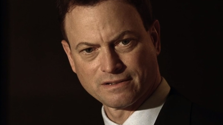 Gary Sinise looking down