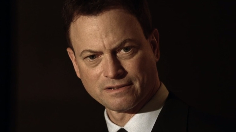Gary Sinise looking down