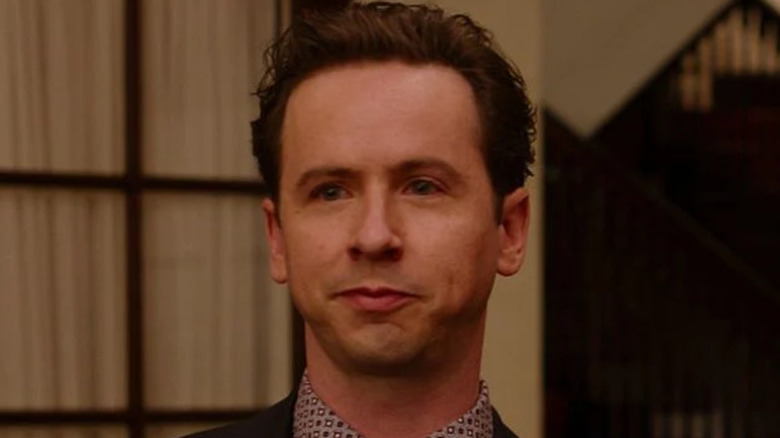 Nick stand inside a house entrance in "Ginny & Georgia" (2021-2025)