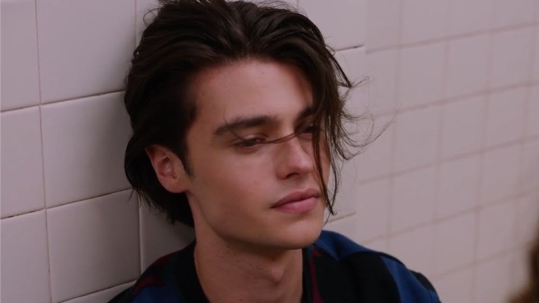 Marcus Baker leans against a wall in "Ginny & Georgia" (2021-2025)