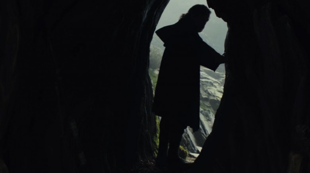 Luke Skywalker stands at cave entrance in Last Jedi