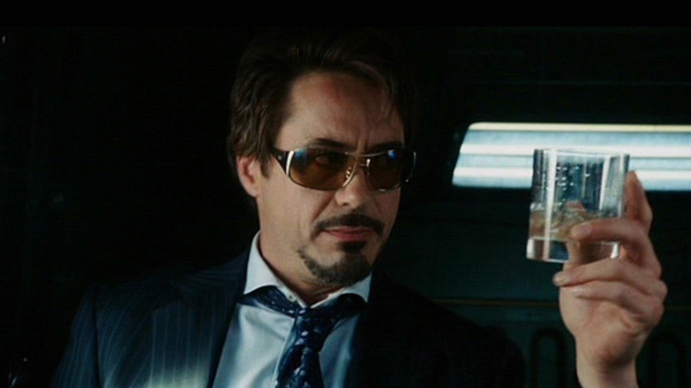 Tony Stark holding glass