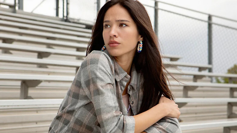 Monica Dutton sitting on bleachers