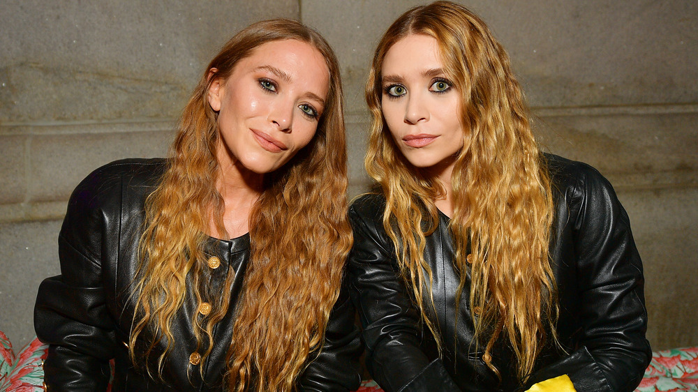 Mary-Kate and Ashley Olsen smiling