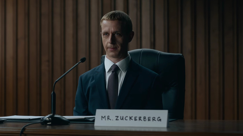 Mark Zuckerberg sitting in front of a microphone in The Social Reckoning