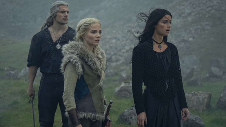 Geralt, Ciri, and Yennefer gazing in surprise