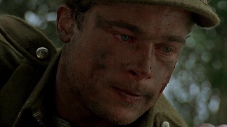 Brad Pitt holds Henry Thomas